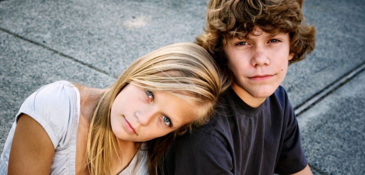 How is the age of transition in boys and girls manifested?