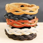 Learning to weave bracelet from leather