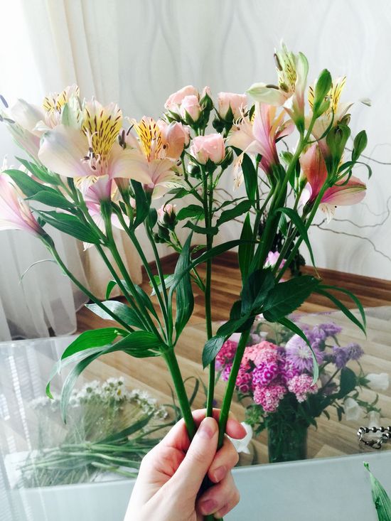 We lay out flowers in a bouquet