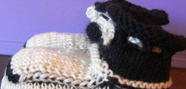 Black and white booties with knitting needles for summer