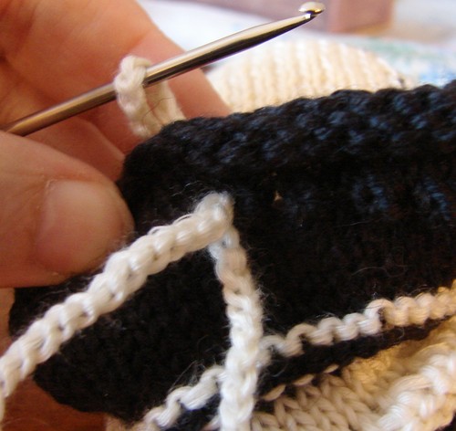 Black and white booties with knitting needles for summer
