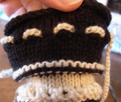 Black and white booties with knitting needles for summer