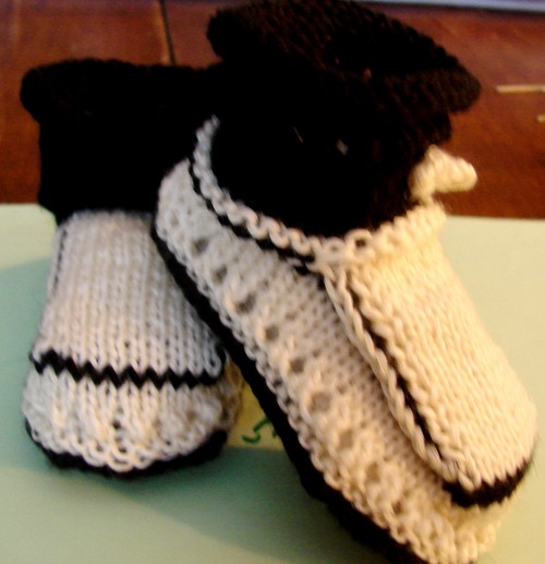 Black and white booties with knitting needles for summer