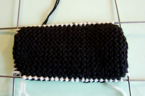 Black and white booties with knitting needles for summer