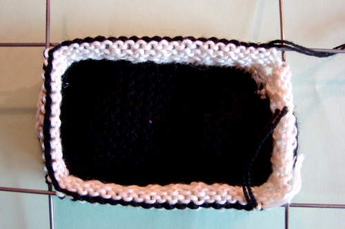Black and white booties with knitting needles for summer
