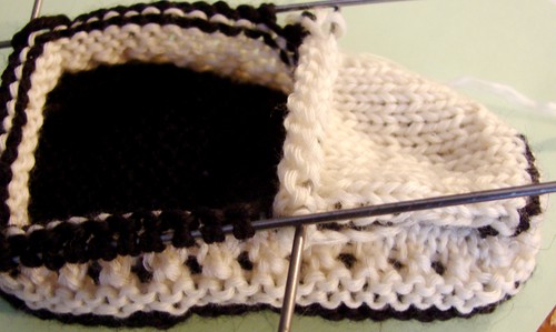 Black and white booties with knitting needles for summer