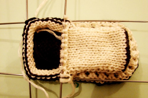 Black and white booties with knitting needles for summer