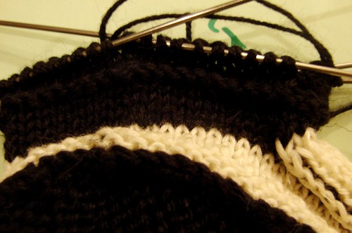 Black and white booties with knitting needles for summer