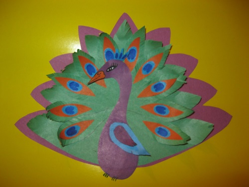 Fabulous peacock made of colored paper