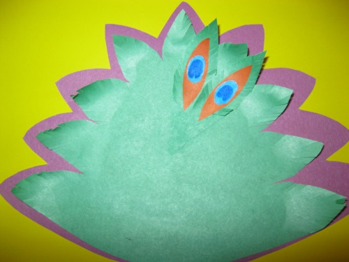 Fabulous peacock made of colored paper