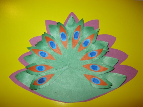 Fabulous peacock made of colored paper