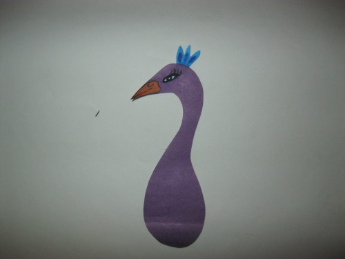 Fabulous peacock made of colored paper