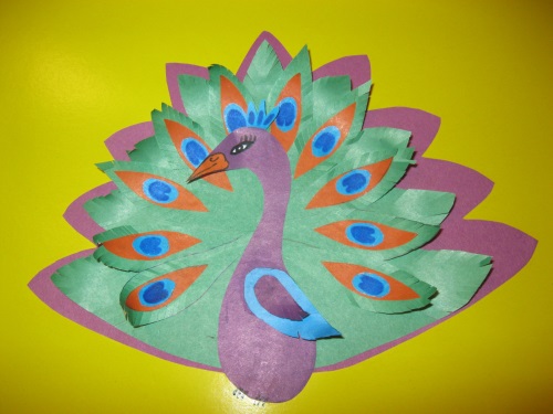 Fabulous peacock made of colored paper