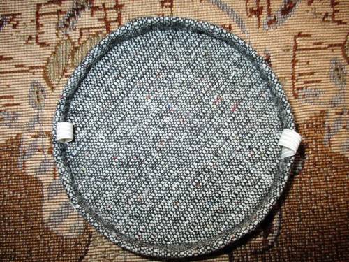 Capsule with a veil