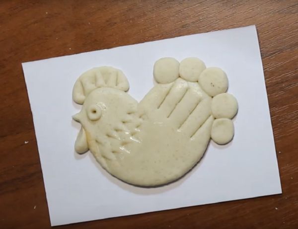 Rooster with his own hands