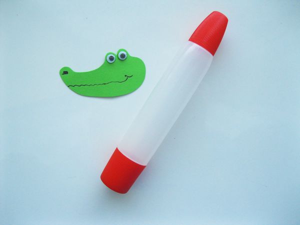 Crocodile made of colored paper with own hands