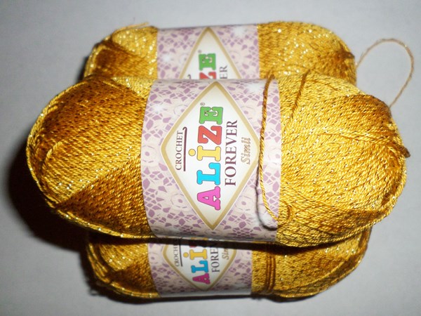 3 skeins of bright yellow yarn with lurex