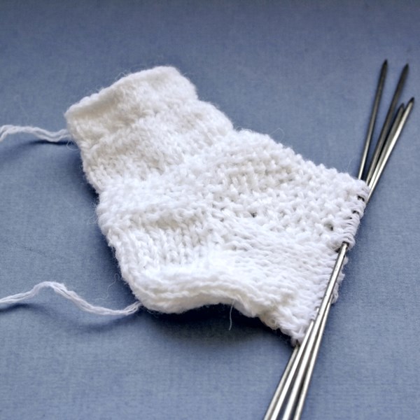 Misok with knitting needles