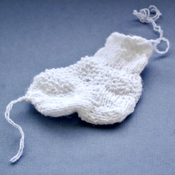 Misok with knitting needles