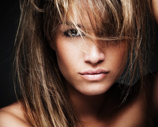 Melting thin strands of dark hair