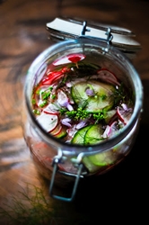 How to preserve cucumbers with onions for the winter