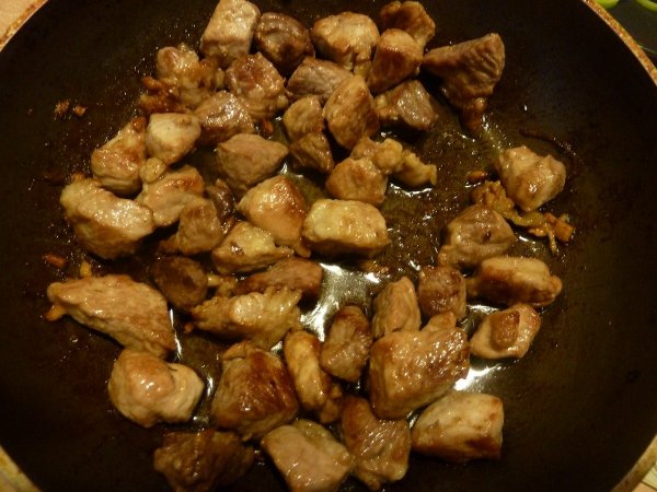 pork chopped finely in a frying pan finely chopped meat