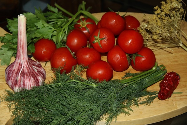 Freshly salted tomatoes in a bag and a saucepan