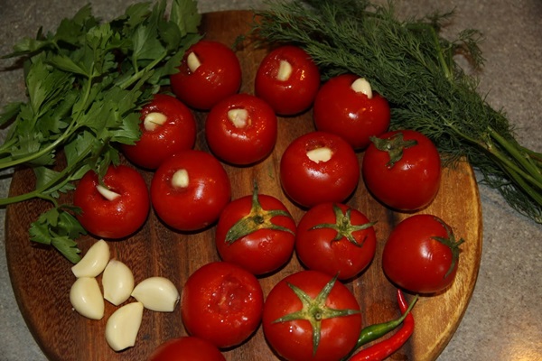 Freshly salted tomatoes in a bag and a saucepan
