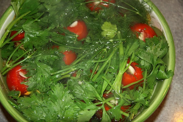 Freshly salted tomatoes in a bag and a saucepan