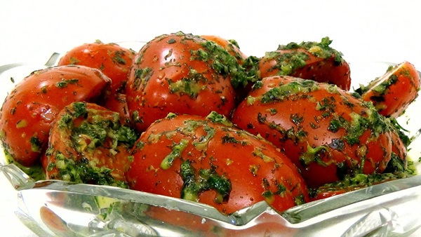 Freshly salted tomatoes in a bag and a saucepan