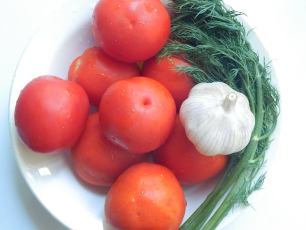 Freshly salted tomatoes in a bag and a saucepan