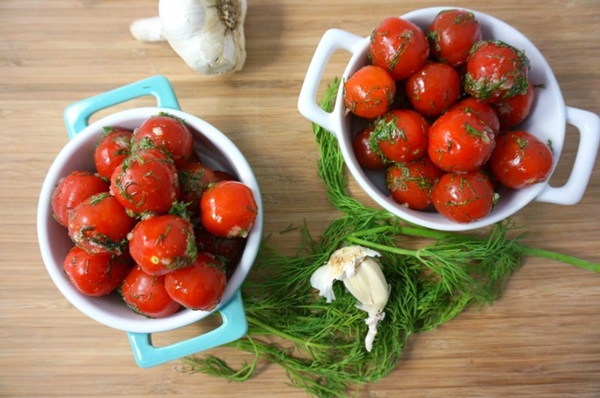 Freshly salted tomatoes in a bag and a saucepan