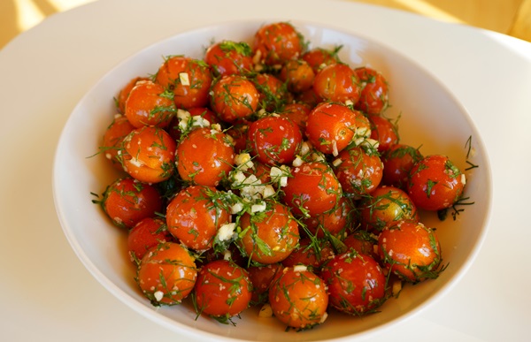 Freshly salted tomatoes in a bag and a saucepan