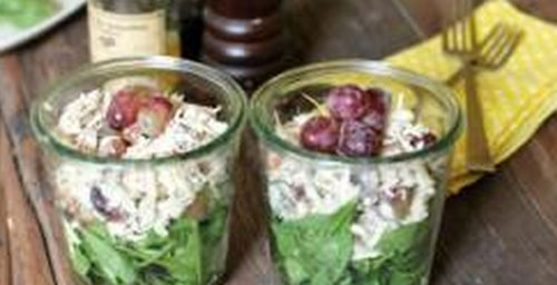 Chicken with grapes in a glass 