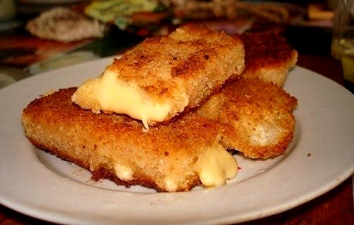 breaded cheese slices on oil